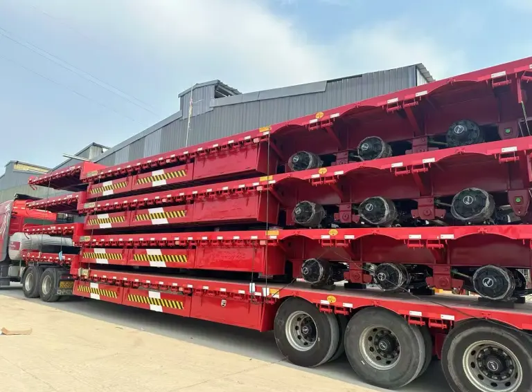 Red Lowbed Trailers Loaded at Factory for Angola