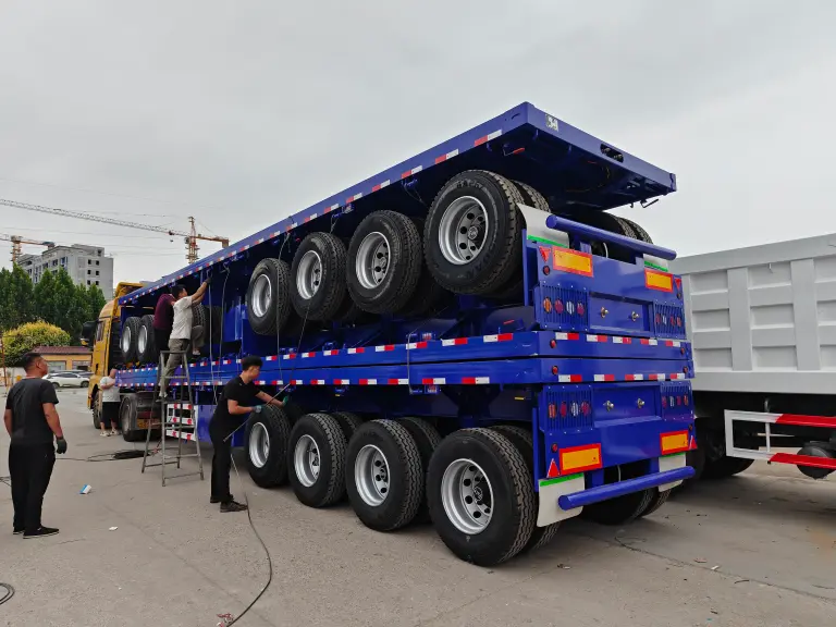 Three 4‑axle flatbed semi‑trailers have been shipped to Kenya